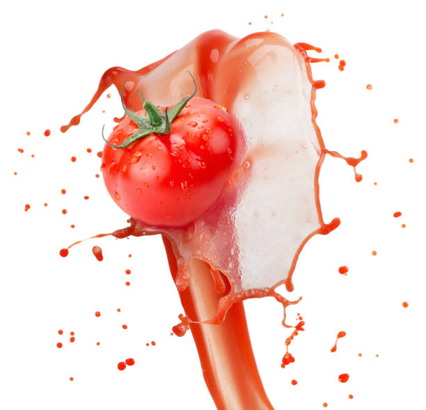 istock tomato in juice splash isolated on a white background 1076213440