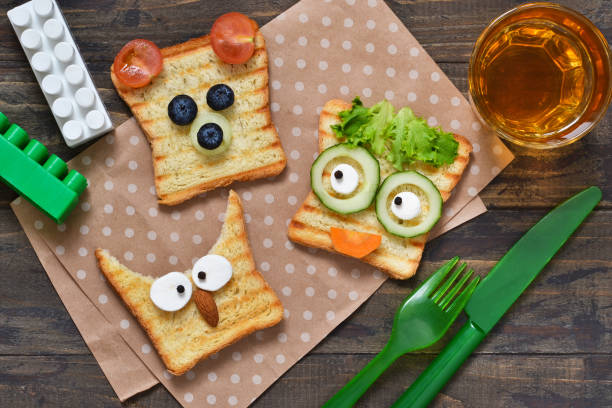istock Baby Funny toast - breakfast for children. 1076215572