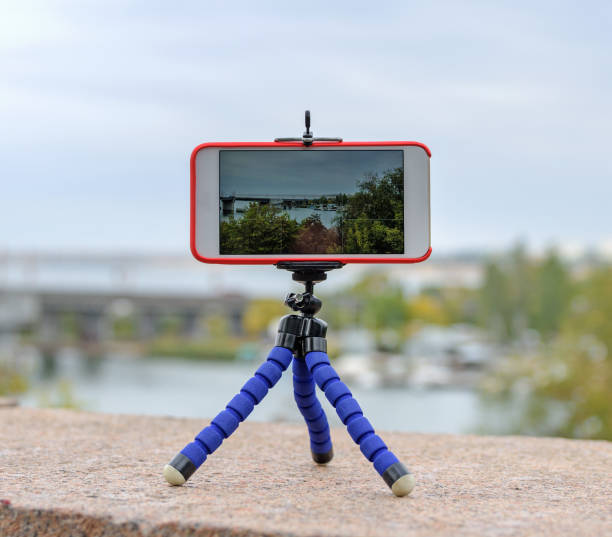 istock smartphone stands on tripod and shoots landscape 1076216976