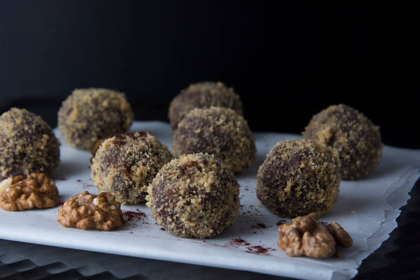 Energy healthy homemade truffles. Uncooked sweet balls made from walnuts and biscuits.