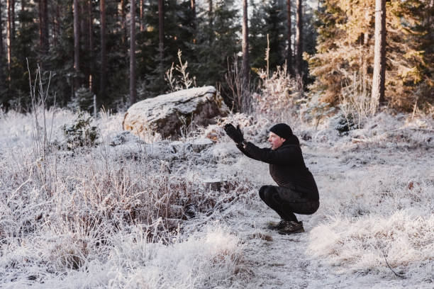 istock Man outdoors in winter doing exercise and training in cold frost weather 1076220926