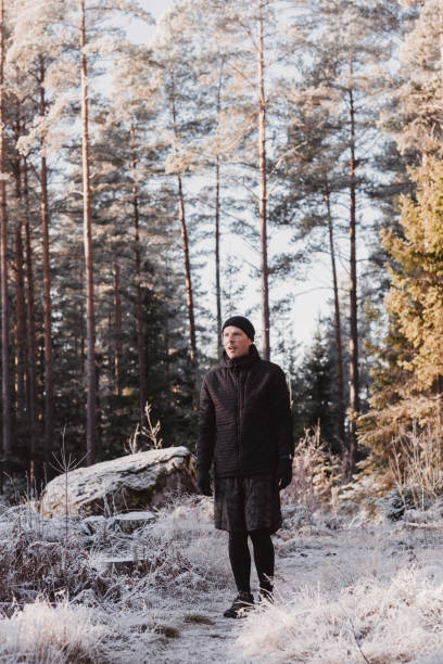 istock Man outdoors in winter doing exercise and training in cold frost weather 1076225254