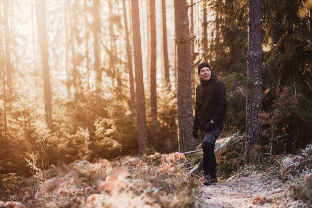 istock Man outdoors in winter doing exercise and training in cold frost weather 1076230612
