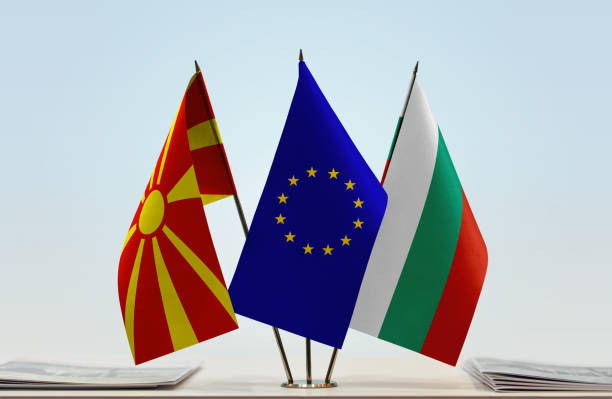 Flags of Macedonia FYROM European Union and Bulgaria Flags of Macedonia FYROM and Bulgaria with a EU flag in the middle capital region stock pictures, royalty-free photos & images