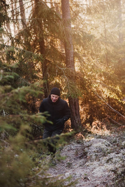 istock Man outdoors in winter doing exercise and training in cold frost weather 1076233296