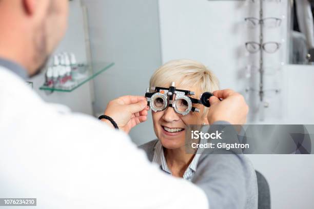 Mature Woman Having Eyesight Exam And Diopter Measurement At The Ophthalmology Clinic Stock Photo - Download Image Now