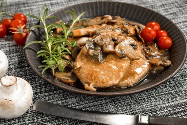 istock Braised pork chop with mushrooms. 1076239140