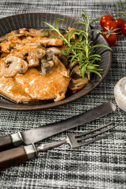 istock Braised pork chop with mushrooms. 1076239190