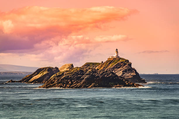 istock Lighthouse at beautiful Faeroe islands during magical sunset, summer time 1076242674