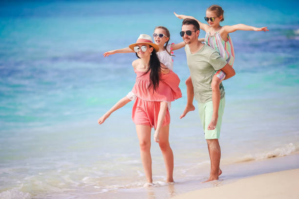 istock Young family on vacation on the beach 1076243688