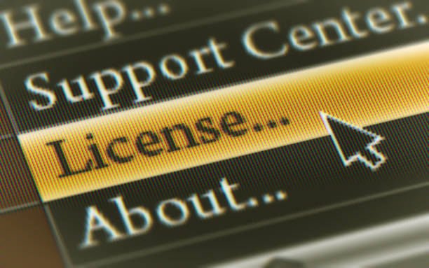 "License" on the Screen. stock photo
