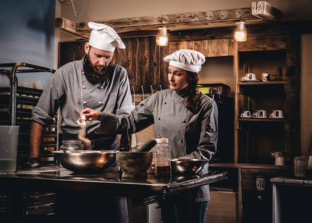 istock Cook assistant pours sesame into a bowl. 1076248984