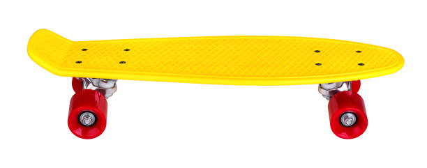 istock Yellow cruiser penny plastboard with red wheels 1076249782