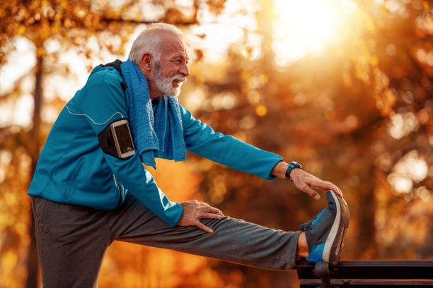 istock Attractive senior man jogging in the park 1076253570