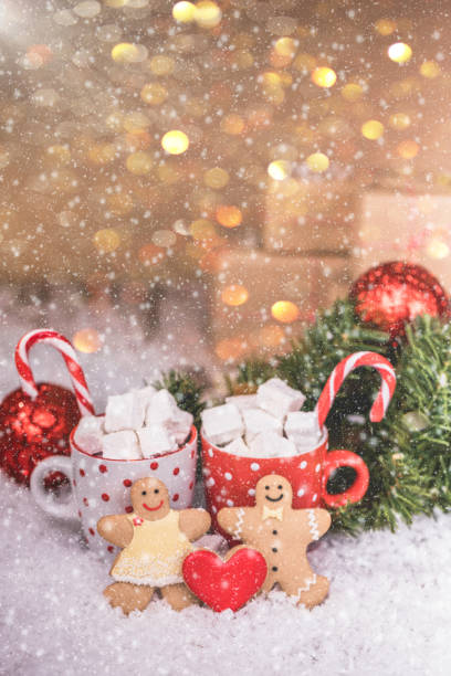 istock Christmas gingerbread couple and hot chocolate with marshmallow 1076253684