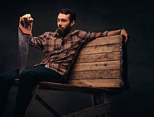 istock The bearded carpenter fell asleep on wooden pallets. 1076258072