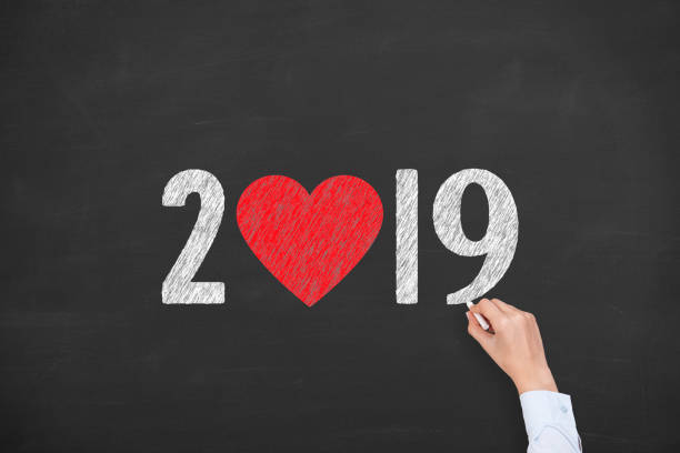 istock New Year 2019 with Heart Shape on Chalkboard Background 1076267050