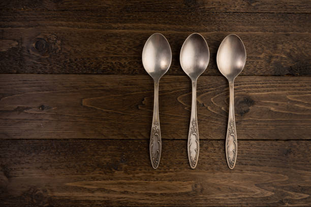 istock Vintage spoons collection on old wooden background top view 1076274194