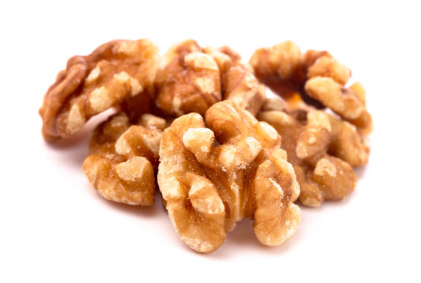 istock A Pile of Healthy Walnuts on a White Background 1076277704