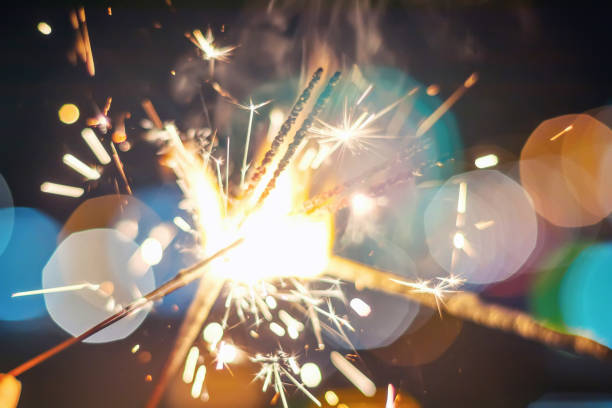 istock Sparkler Bokeh Colorful sparkler. Night background with a sparkler. 1076280836