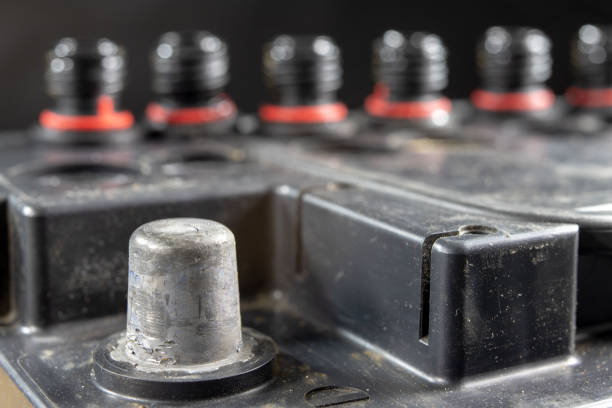 istock Charging and operating the car battery. Car accessories in the workshop. Dark background. 1076295314
