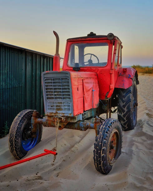 istock Big red tractor on the beach in Ahlbeck. Germany 1076295376