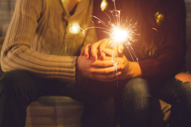 istock Young couple holding sparkler 1076300366