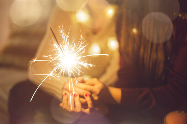 istock Young couple holding sparkler 1076300410