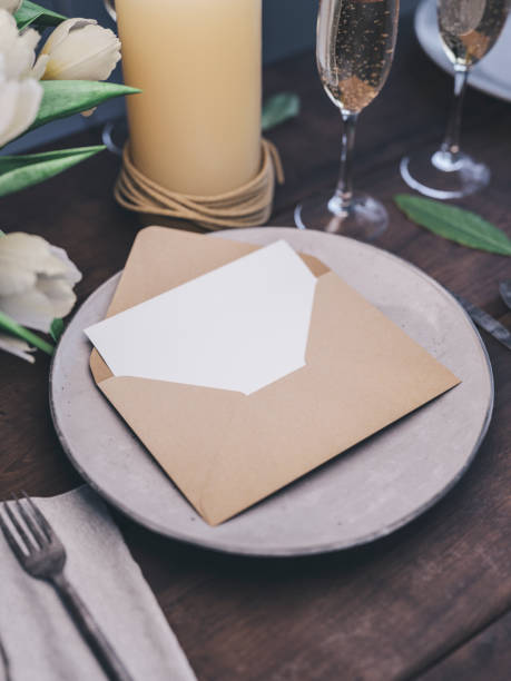 istock Envelope with an elegant wedding invitation. Place card mockup. 1076305044