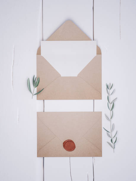 istock Envelope with an elegant wedding invitation. Place card mockup. 1076305604