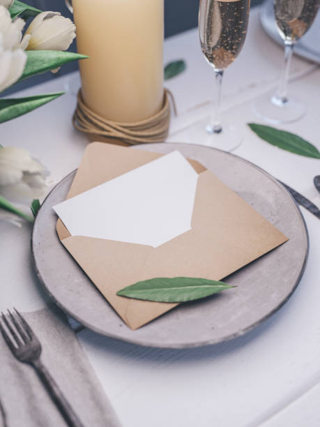 istock Envelope with an elegant wedding invitation. Place card mockup. 1076305672