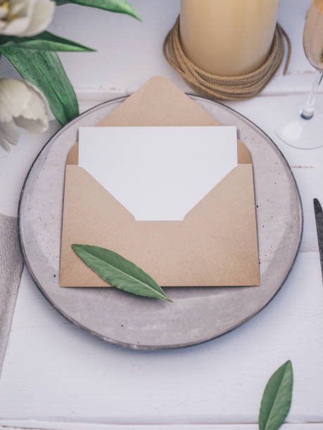 istock Envelope with an elegant wedding invitation. Place card mockup. 1076305678