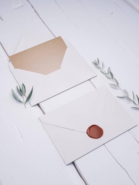 istock Envelope with an elegant wedding invitation. Place card mockup. 1076305982
