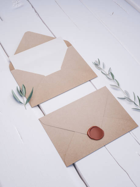 istock Envelope with an elegant wedding invitation. Place card mockup. 1076306010