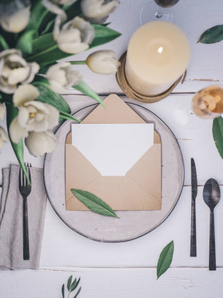 istock Envelope with an elegant wedding invitation. Place card mockup. 1076306264