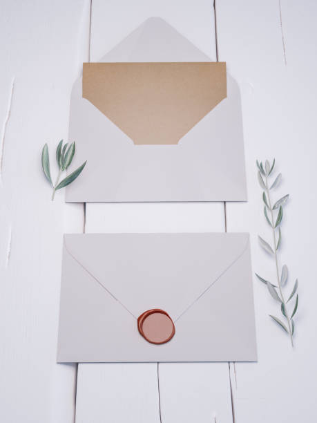 istock Envelope with an elegant wedding invitation. Place card mockup. 1076306490