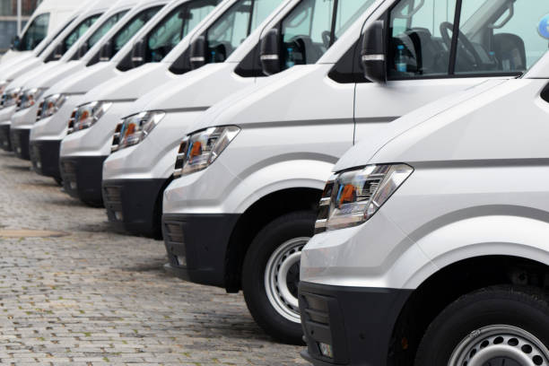 Delivery vans parked on the parking Hamburg, Germany - 30 August, 2018: Delivery vans Volkswagen e-Crafter parked on the parking. Today this model is one of the most popular electric LCV vehicles in Europe. auto shipping stock pictures, royalty-free photos & images