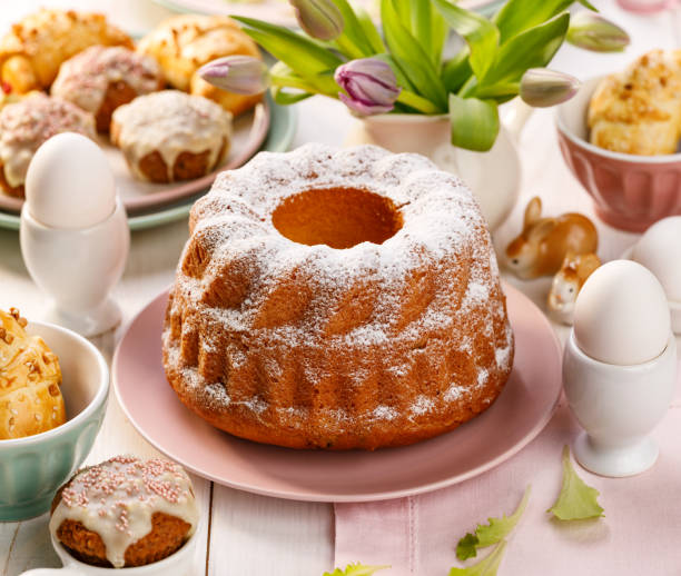 istock Easter yeast cake sprinkled with powdered sugar on the holiday table. 1076313214