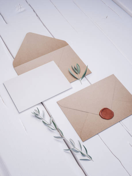 istock Envelope with an elegant wedding invitation. Place card mockup. 1076319264