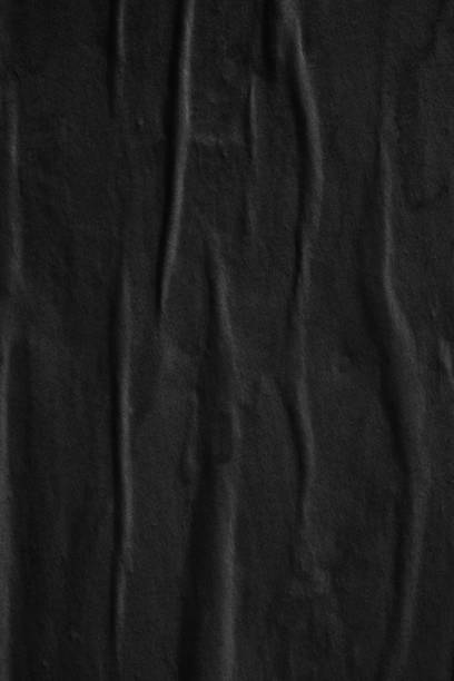 istock Dark black blank paper backgrounds creased crumpled surface old torn ripped posters grunge textures placard 1076320212