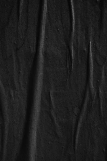 istock Dark black blank paper backgrounds creased crumpled surface old torn ripped posters grunge textures placard 1076320812