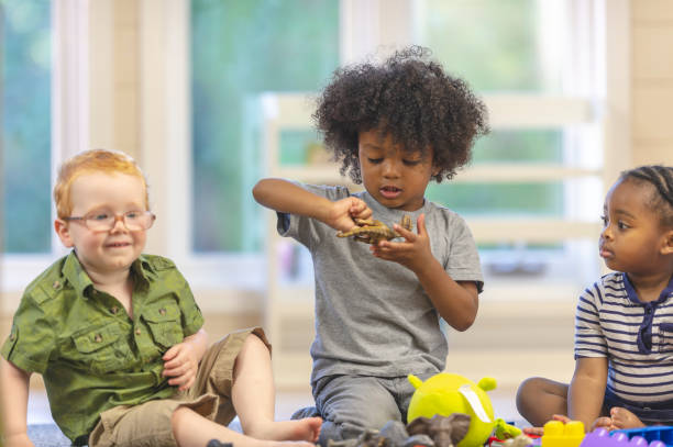 istock Children with dinosaur toys 1076322854