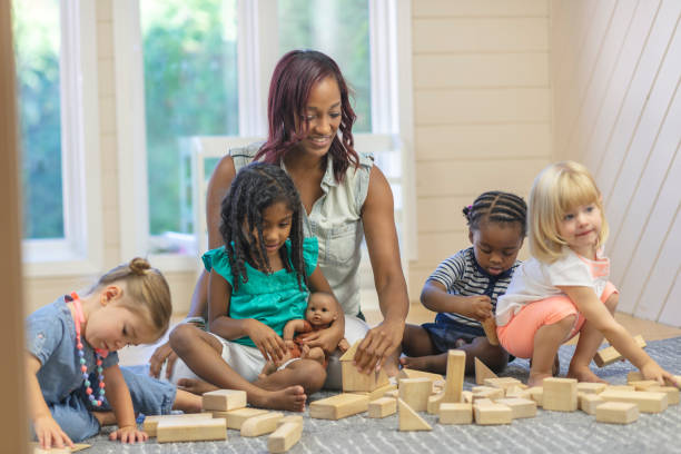 istock Daycare playing with wooden blocks 1076322864
