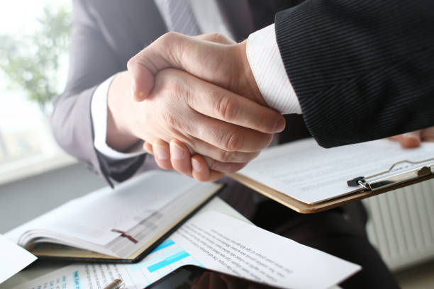 istock Man in suit shake hand as hello in office 1076328894