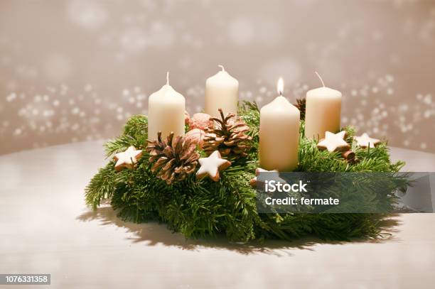 First Advent Decorated Advent Wreath From Fir And Evergreen Branches With White Burning Candles Tradition In The Time Before Christmas Warm Background With Festive Bokeh And Copy Space Stock Photo - Download Image Now