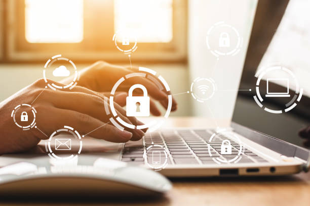 istock Businessman working on laptop. Protection network security computer and safe your data concept. Digital crime by an anonymous hacker 1076339126