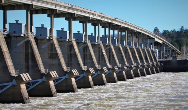istock Water Flowing Through the Toad Suck Ferry Lock and Dam, Arkansas River, on a Winter Morning. 1076339628