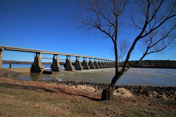 istock Water Flowing Through the Toad Suck Ferry Lock and Dam, Arkansas River, on a Winter Morning. 1076339792