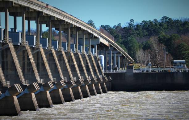 istock Water Flowing Through the Toad Suck Ferry Lock and Dam, Arkansas River, on a Winter Morning. 1076339856