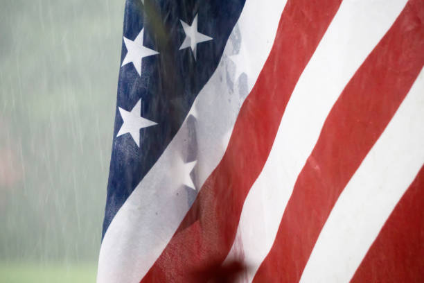 istock american usa flag with rainy weather 1076351270